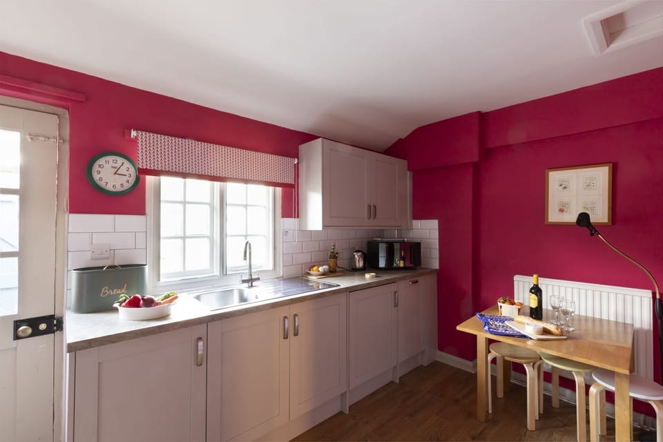 Bishop Lightfoot Cottage - the kitchen with a foldout table