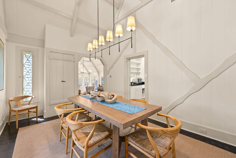 Elegant dining area with seating for 6, featuring warm lighting and charming interiors for memorable meals.
