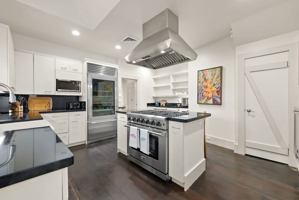 Fully equipped gourmet kitchen with professional-grade stovetop and spacious design for cooking enthusiasts.