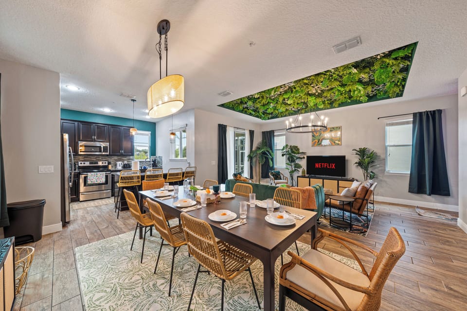 Open floor plan concept featuring living room, dining area, and kitchen