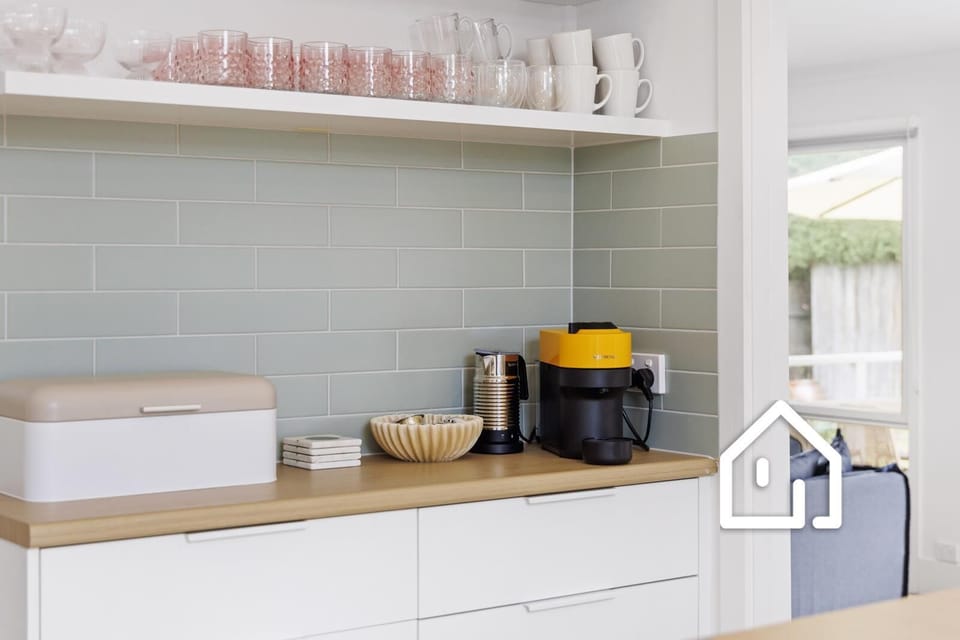 Well-equipped kitchen with Nespresso Vertuo coffee pod machine