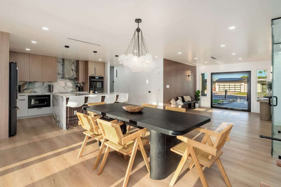 Step into a sun-drenched open space where modern design meets warm, natural comfort. Your eye travels from the sleek kitchen through to the inviting lounge and out to your private outdoor retreat.