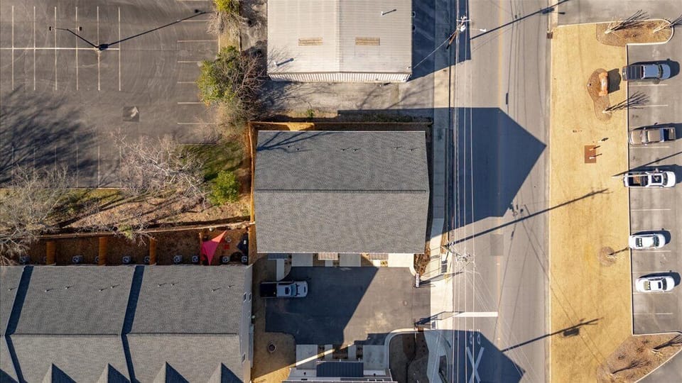 The unit has room for one vehicle in the garage and one small vehicle in the driveway in front of the garage