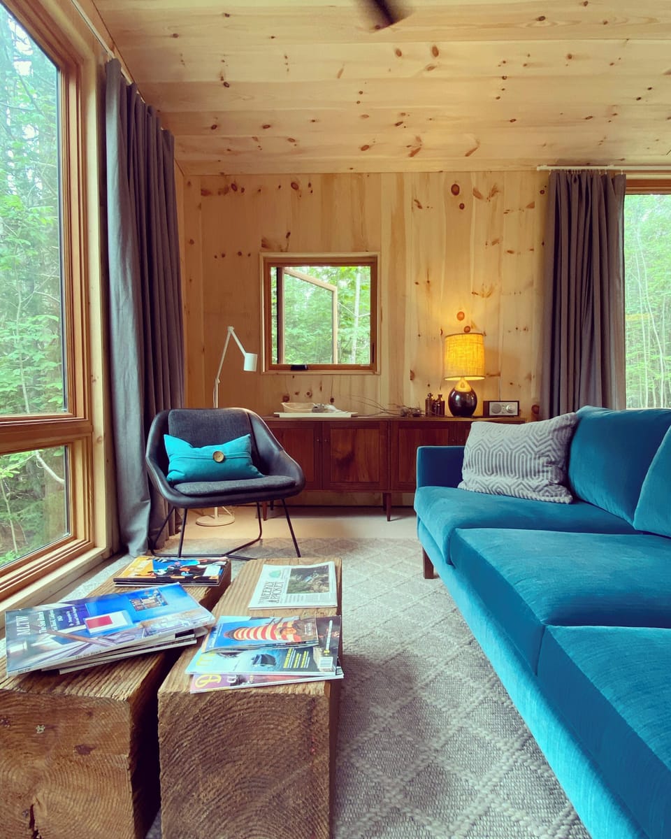 Plush sofa in sitting area. Front row view towards the Benjamin River Harbor.