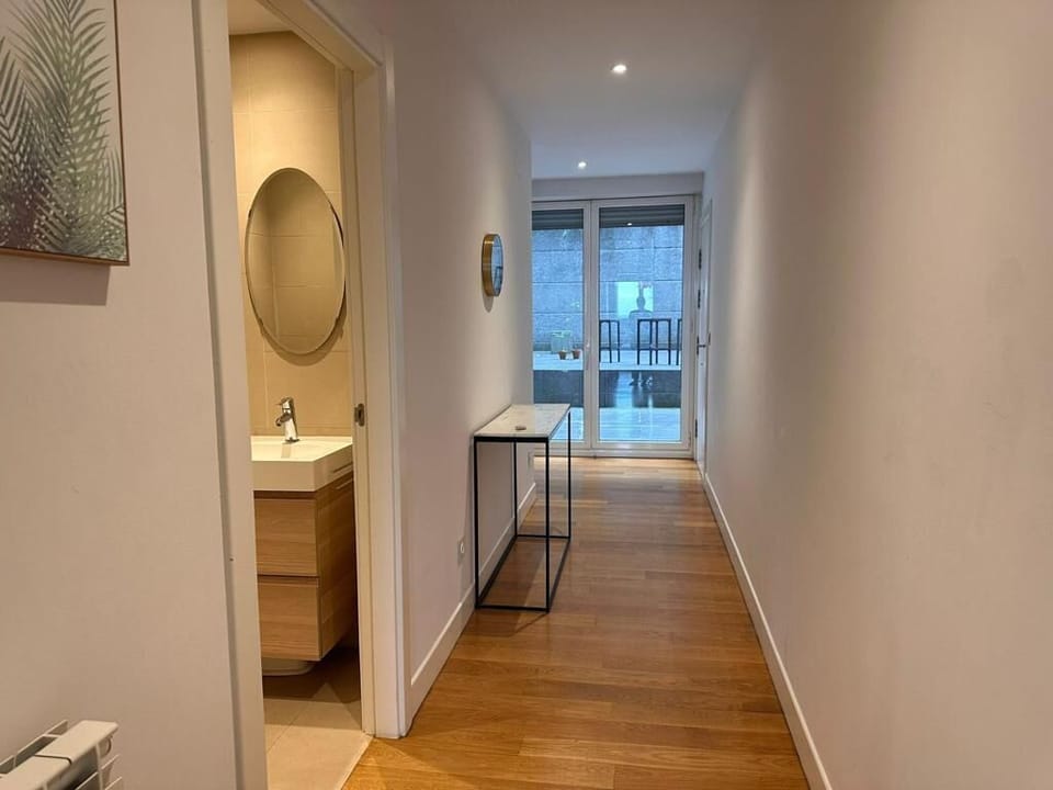 hallway, guest toilet and exit to the private terrace 