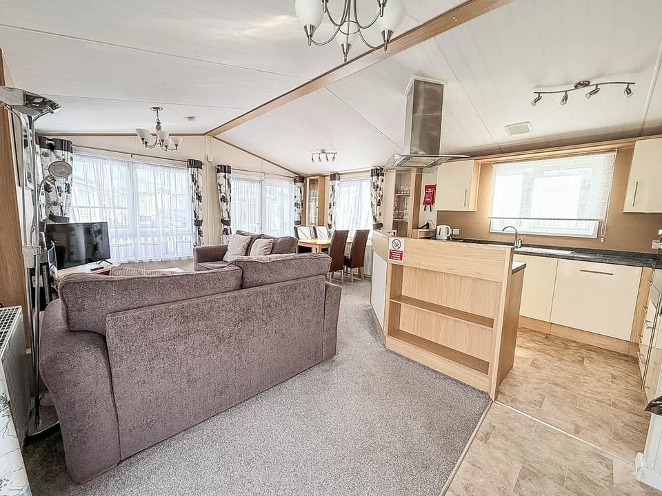 This communal space is the heart of your holiday retreat, allowing the whole family to be together whether you're cooking a meal, enjoying dinner, or relaxing on the sofa after a day of adventure in Hunstanton.