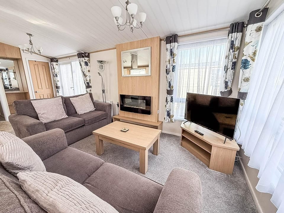 Whether you’re enjoying a family movie night, sharing stories from your day at Hunstanton beach, or simply curling up with a good book, this space is your home away from home.