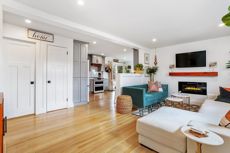 Living room, 2 comfortable sofas, one w/ a chaise. Fire feature & flat screen!