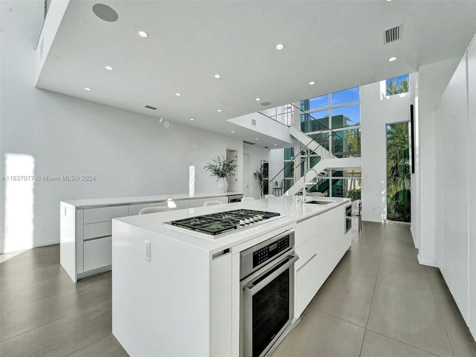 Refined culinary space showcasing sleek modern design with elegant architectural elements and seamless indoor outdoor connections