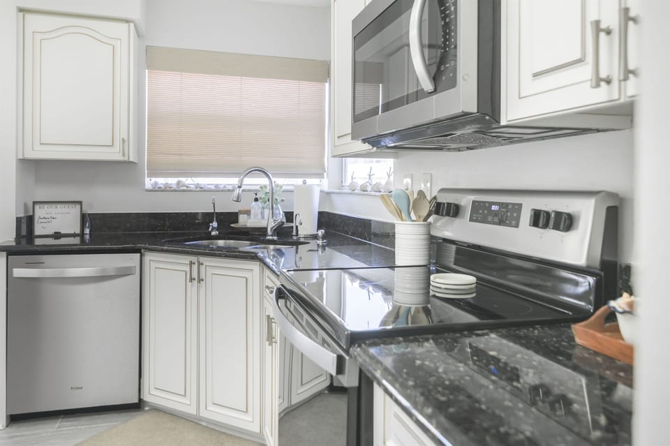 Fully equipped with modern appliances, the kitchen makes meal prep a breeze—whether you're brewing morning coffee or cooking up local seafood