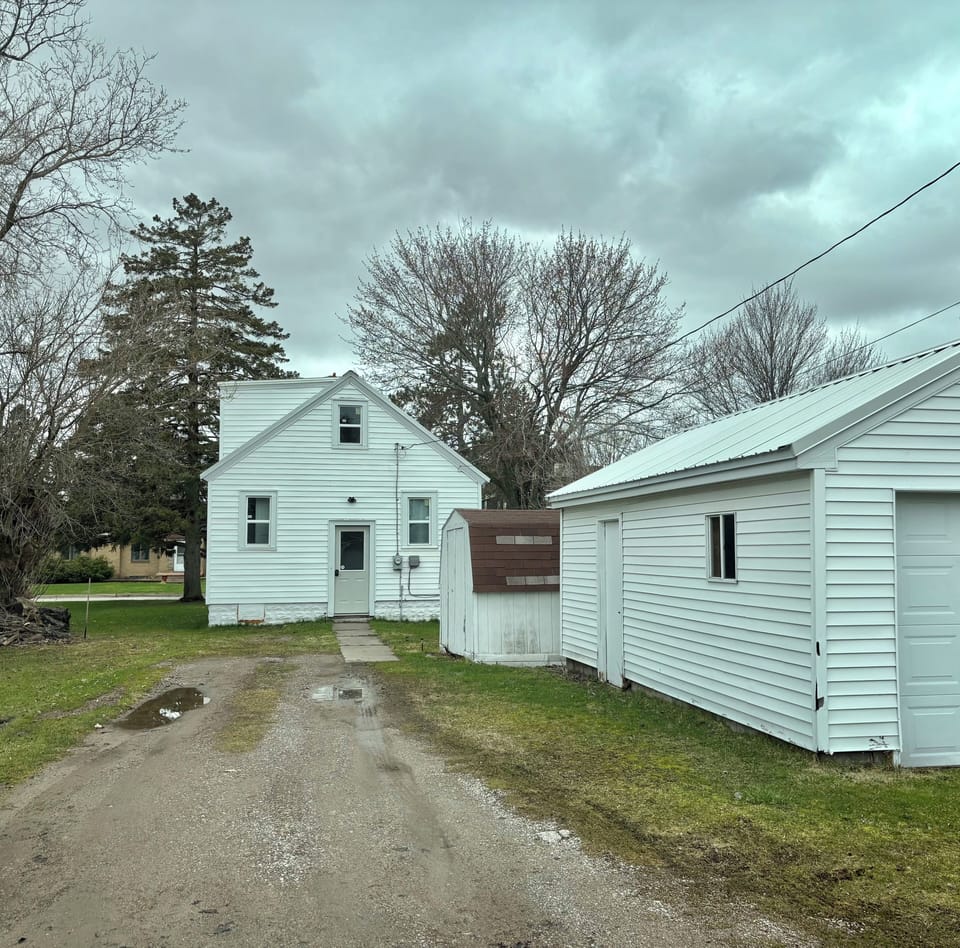 Rear of home accessible via the alley. Garage is not open to guests.