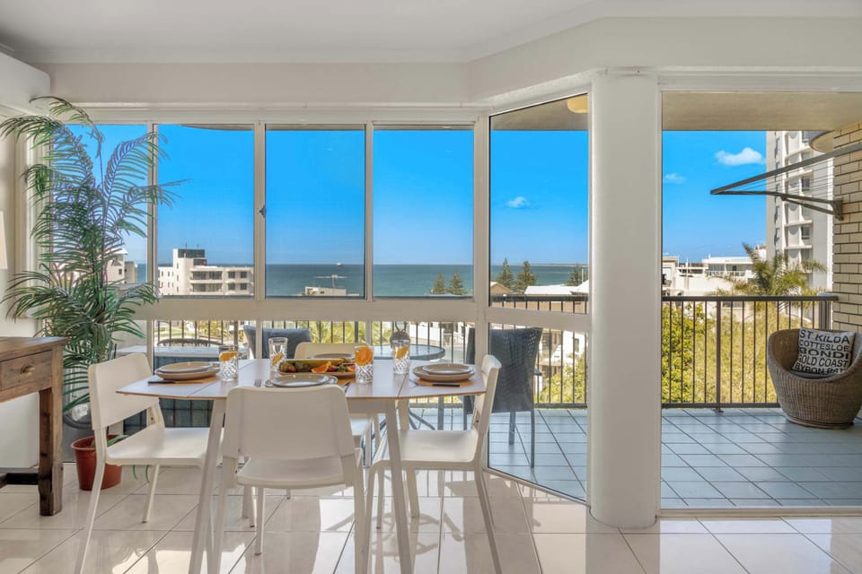 Caloundra holiday apartment with ocean views modern interiors and access to a sparkling swimming pool