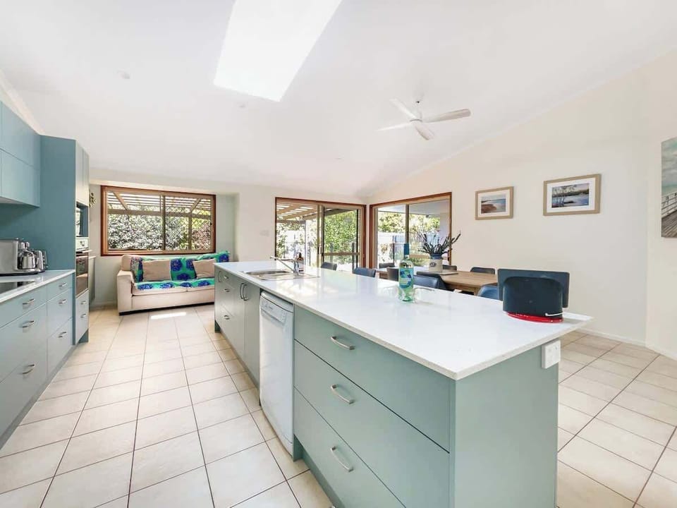 The kitchen offers ample space to prepare meals.