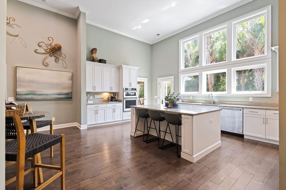 Culinary enthusiasts will find everything they need in the fully equipped kitchen featuring modern appliances, granite countertops, and a large kitchen island.