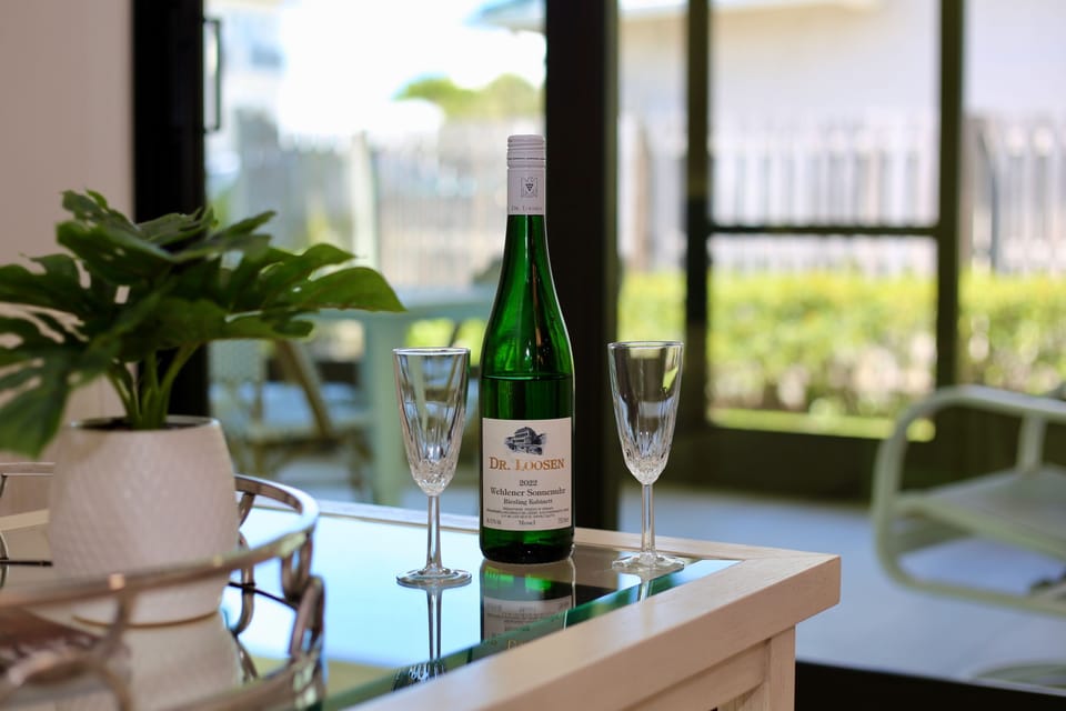 Raise a glass — this home invites celebration, connection, and a little coastal sparkle