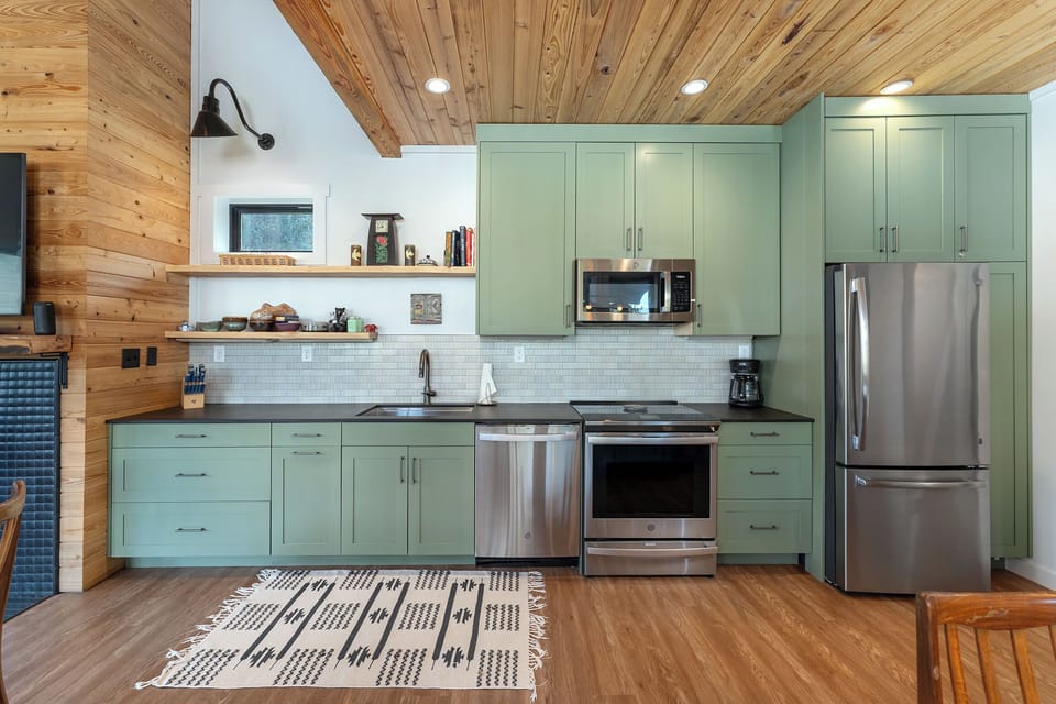 Open-concept kitchen with dishwasher and drip-style coffee maker