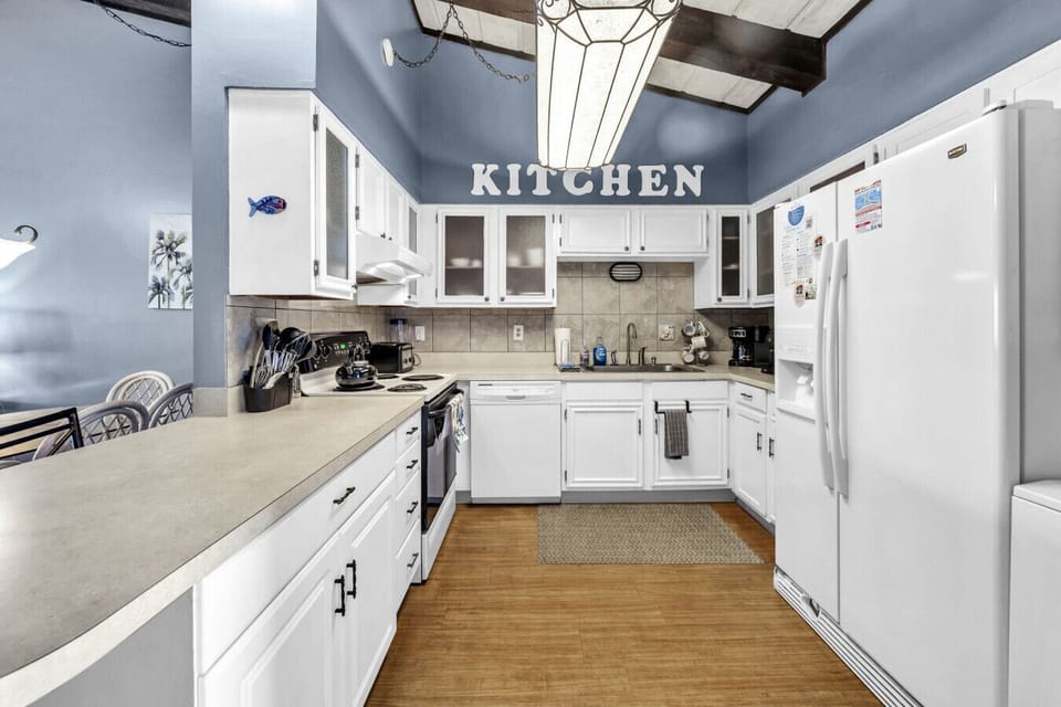 Spacious, fully equipped kitchen with plenty of counter space, perfect for cooking and gathering.