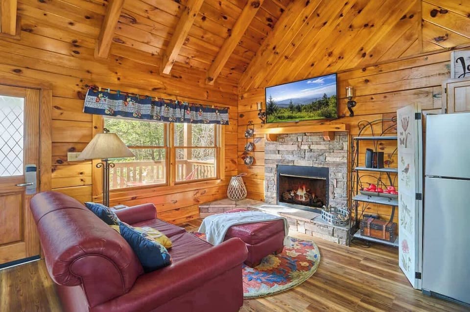 A warm fireplace highlights the living area, ideal for reading or TV time.