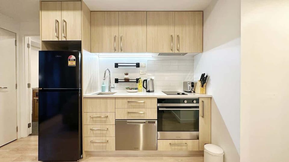 Enjoy culinary freedom in our compact kitchen, equipped with a fridge/freezer, microwave, stovetop, and essential cooking ware. Perfect for easy meals and snacks on the go.
