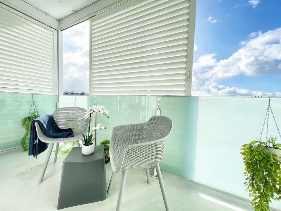 Enjoy coffee and views on the balcony. 