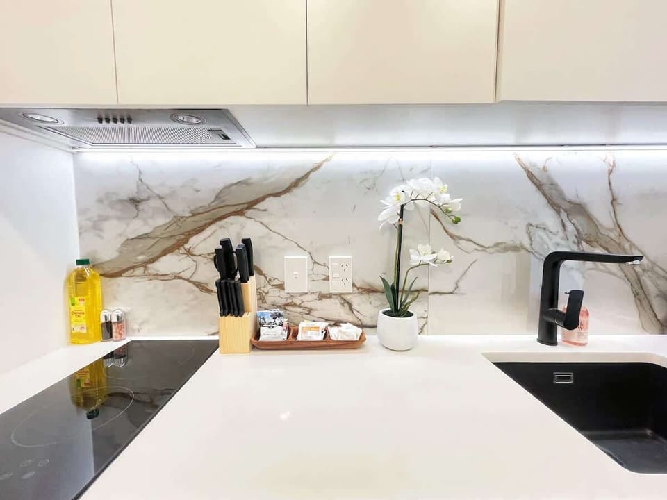 Enjoy culinary freedom in our compact kitchen, equipped with a fridge/freezer, microwave, stovetop, and essential cooking ware. Perfect for easy meals and snacks on the go.