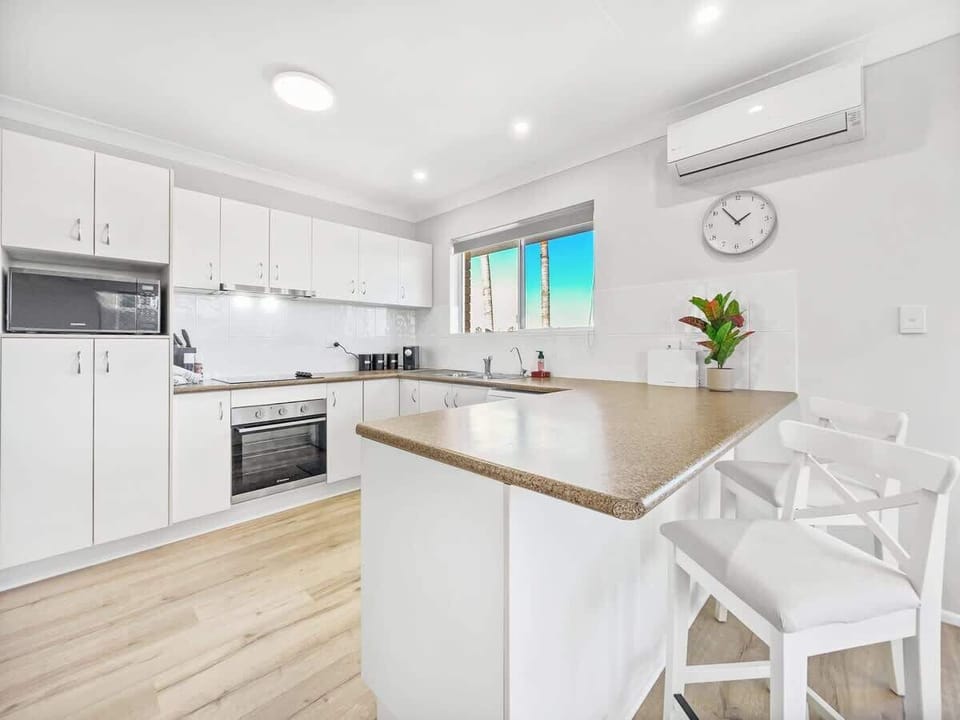 Prepare meals with ease in the fully equipped kitchen stocked with essentials.