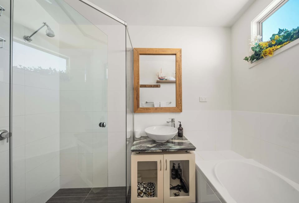 Main bathroom with a separate shower and full sized bathtub