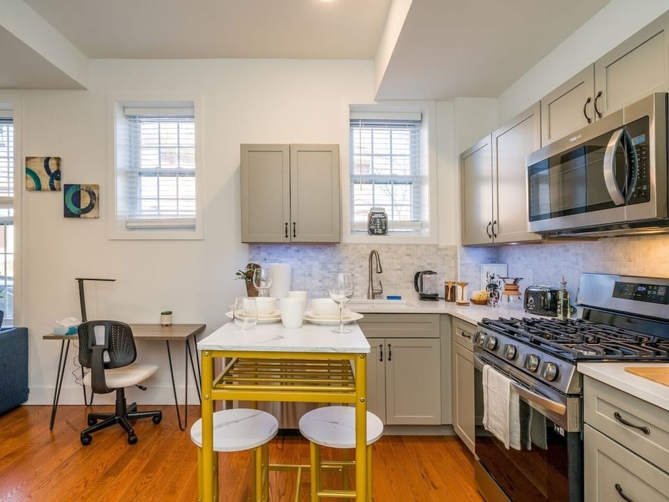 Open kitchen and dining setup perfect for two persons to enjoy meals.
