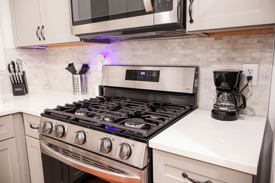 Step into our fully-equipped and modern kitchen, where culinary delights await! This stylish space combines functionality with contemporary design, providing everything you need for a seamless cooking and dining experience.