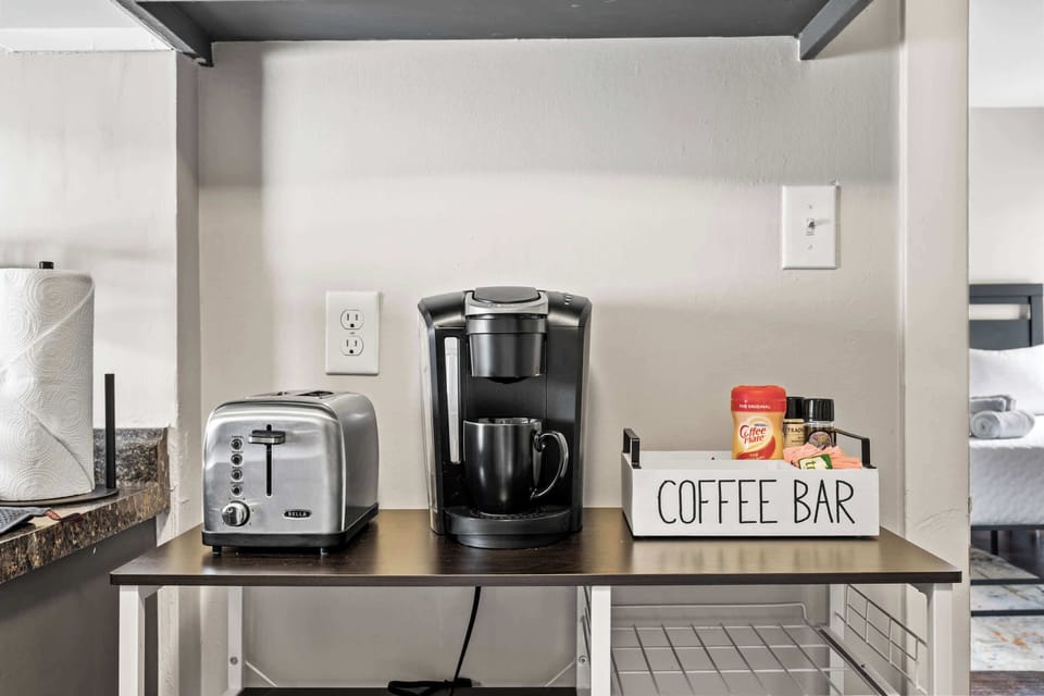 Kitchenette: Efficient & Stylish – A modern kitchenette for easy meal prep.