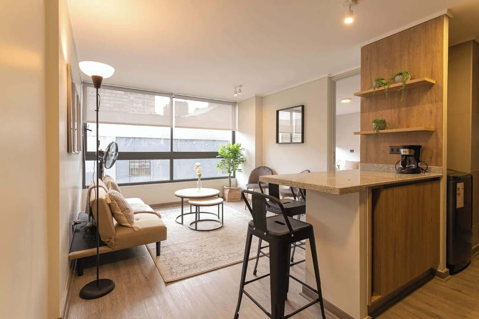 Bright and cozy living area with modern decor, perfect for relaxing after a day of exploring the city.