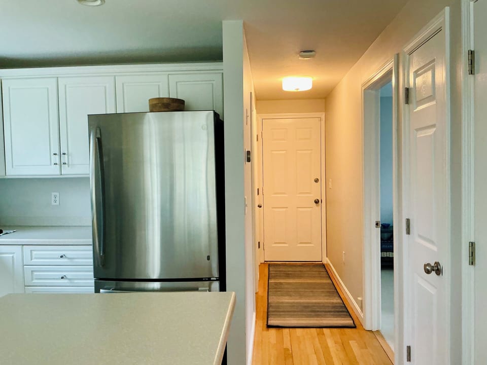 Hallway to the first bedroom and full bath