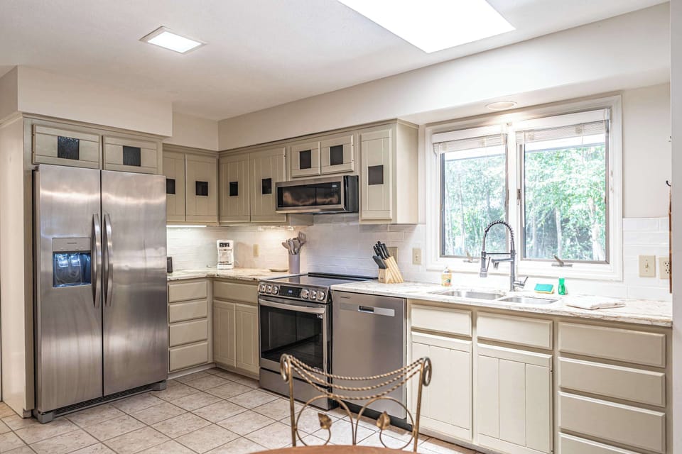 Spacious Kitchen with Dining Access & Natural Light