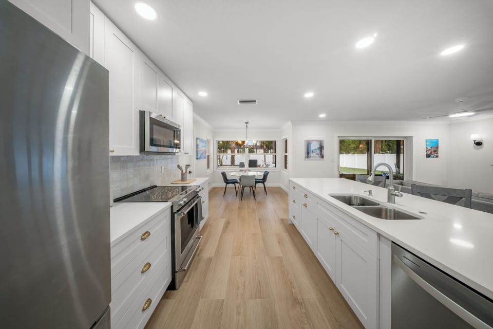Enjoy the kitchen space with island seating, and all the cooking utensils.