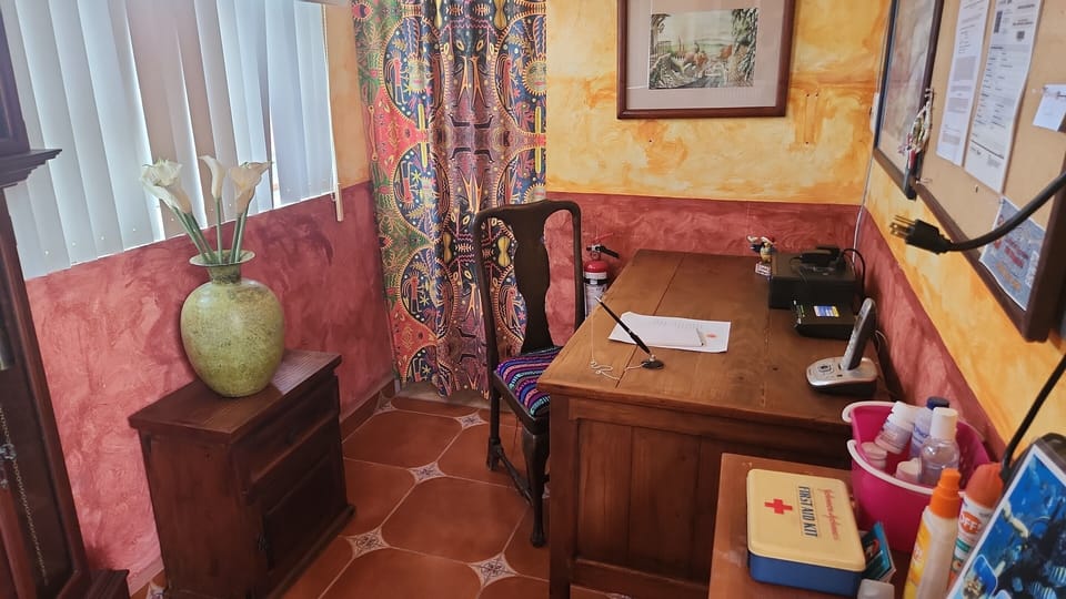 The office with international phone for guest's use & a full bathroom w/ shower.