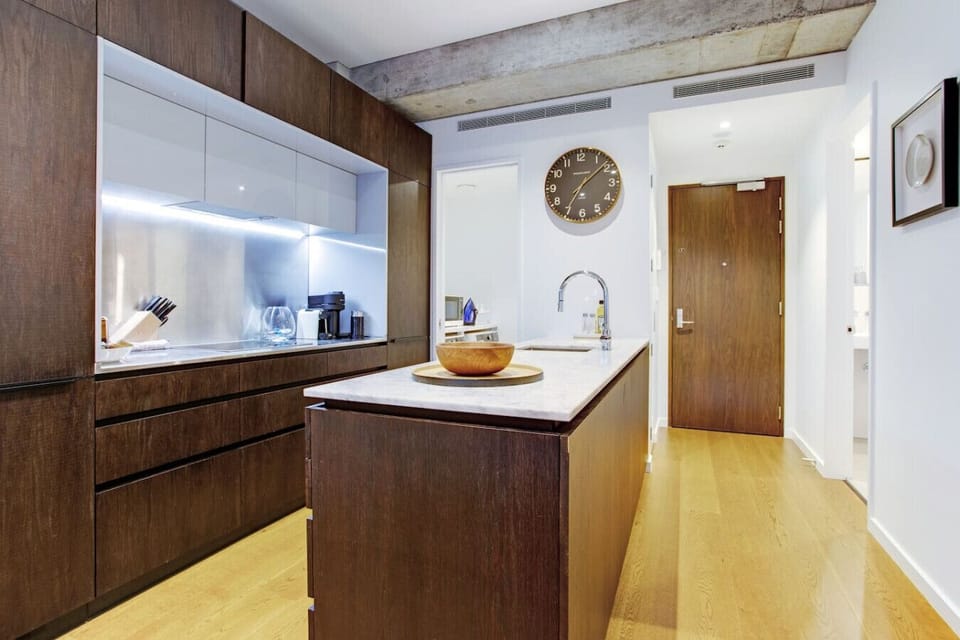 The apartment entrance with the kitchen and bathroom facilities.