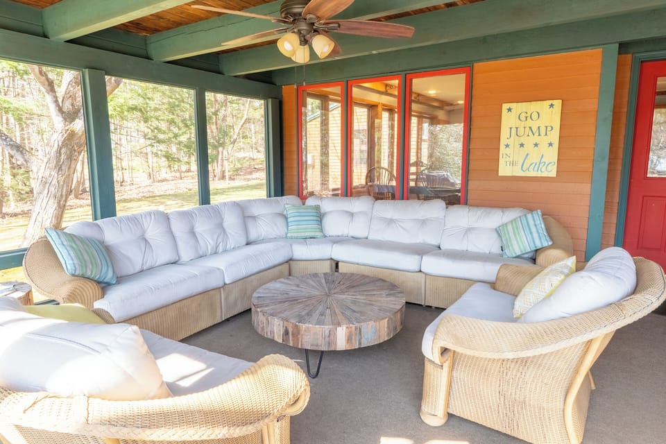 The screened-in porch is an excellent spot for dining outdoors.

