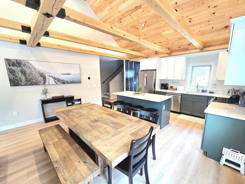 The large dining table is designed to comfortably seat eight people