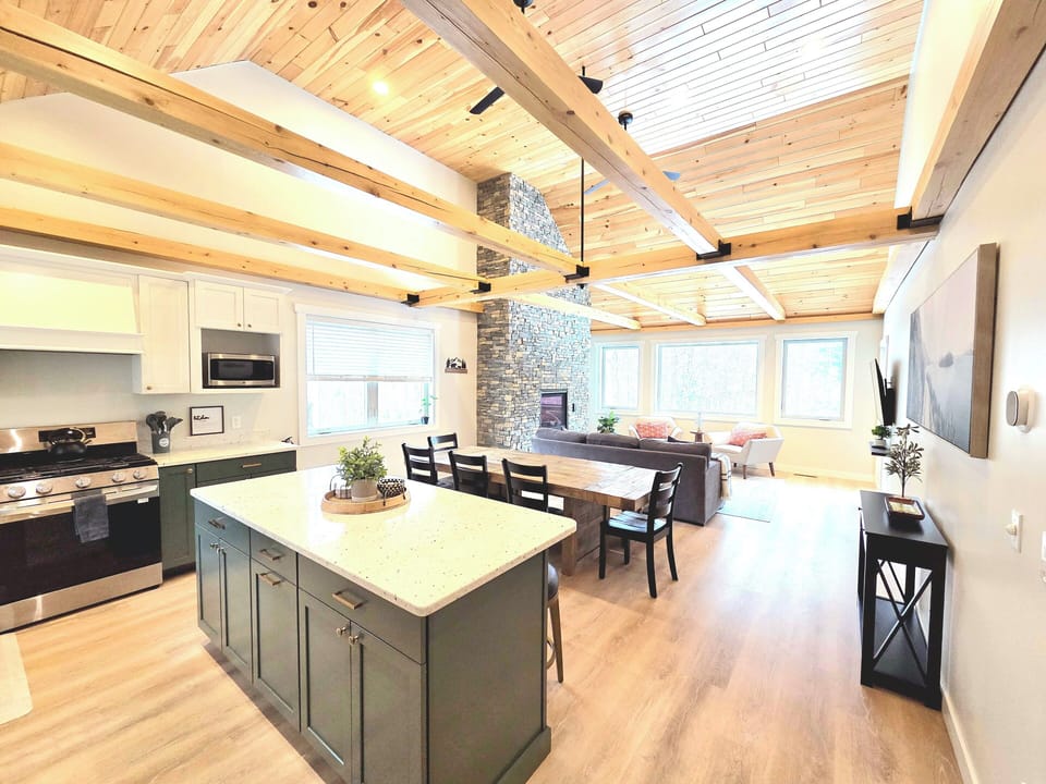 The kitchen is designed to be spacious and open, seamlessly connecting with the 