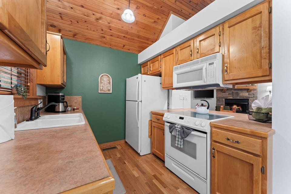 New cookware, utensils, flatware and small appliances in the kitchen.