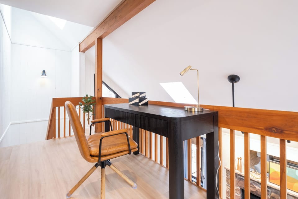 Lofted workspace with plenty of room to spread out—great for deep focus or creative projects.