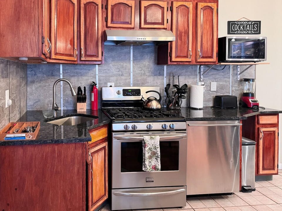 Full kitchen, Blender, toaster, regular coffee, maker, microwave, silverware, can opener, cups, plates, pans, etc.