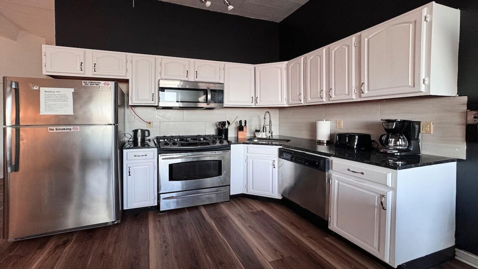 Full kitchen: fridge, microwave, toaster, blender, can opener, regular coffee maker, silverware, cups, plates, etc.