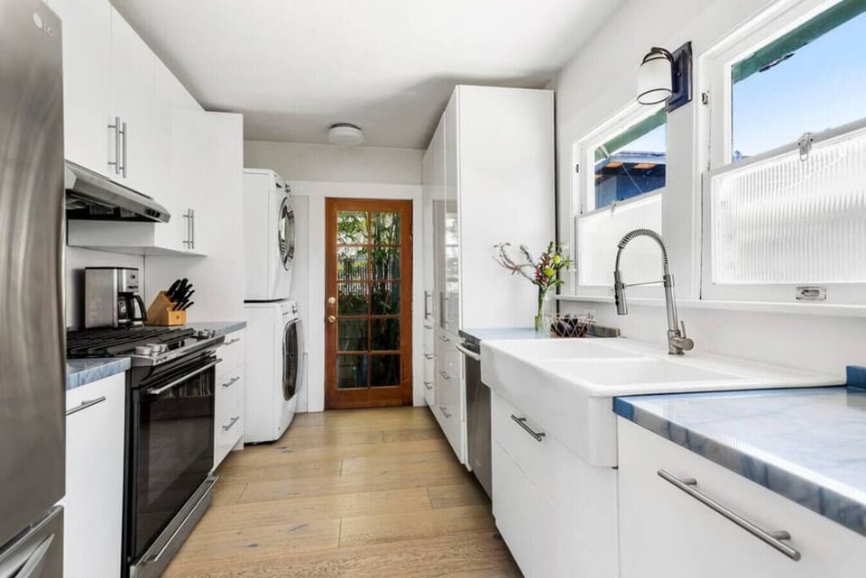 Stylish Kitchen Area with Clean Lines and Ample Cabinet Space