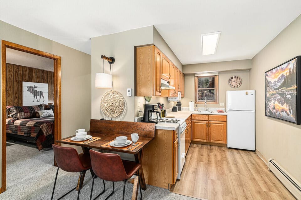 Enjoy the convenience of a full kitchen and a dining table with seating for four.