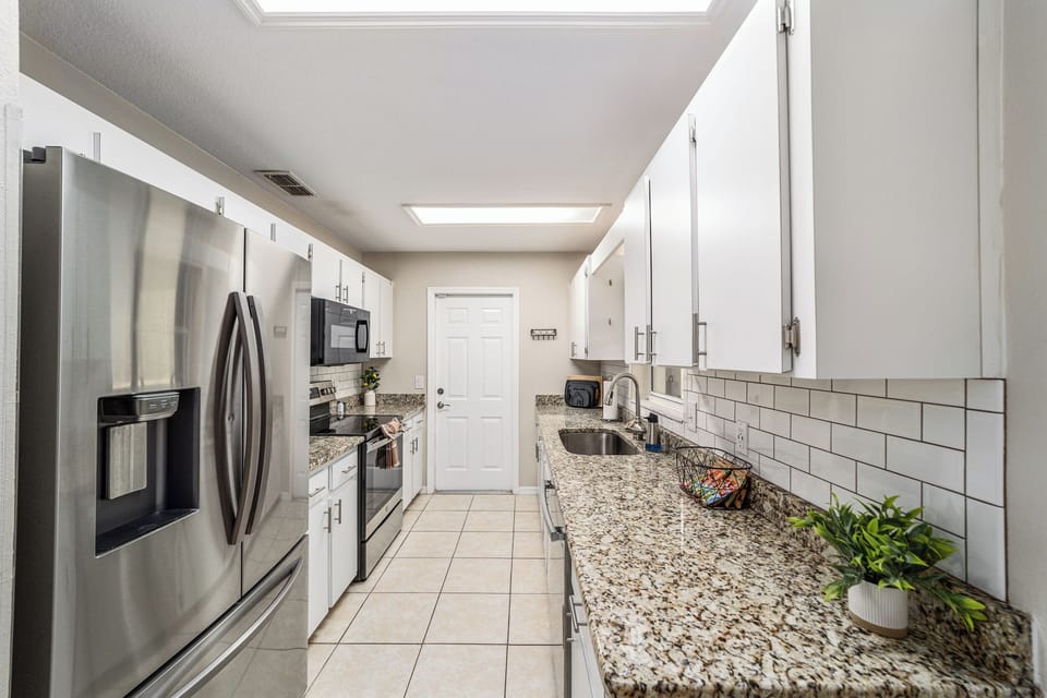 Fully stocked kitchen with modern appliances and all you need to prepare meals.