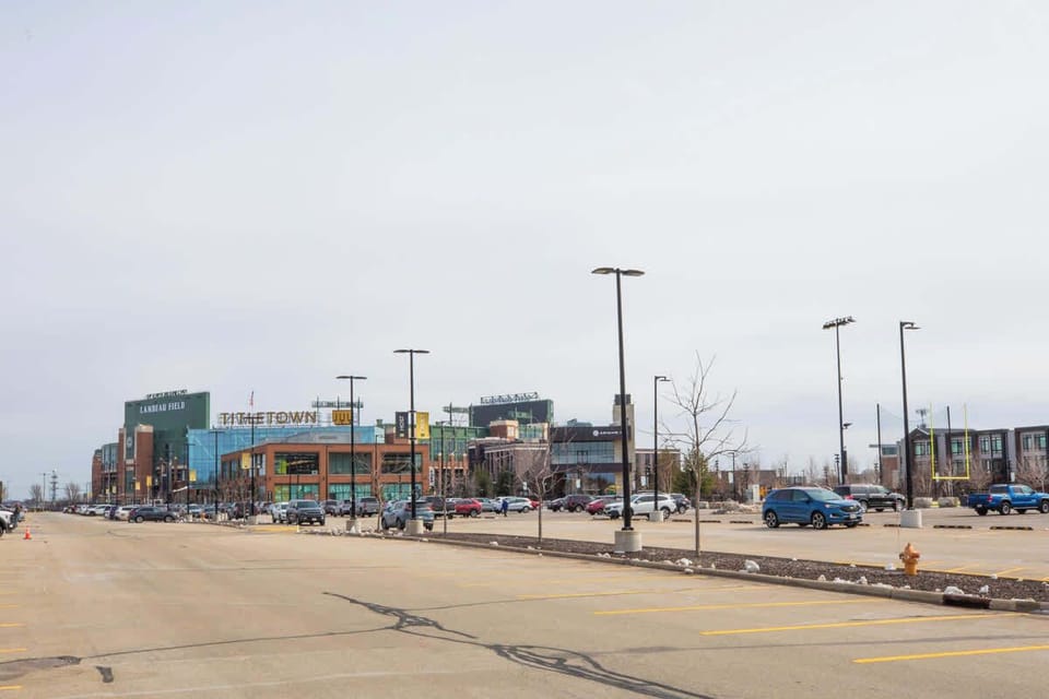 Titletown District with Lambeau Field – Capture the vibrant atmosphere of Titletown District, with the iconic Lambeau Field in the background. A perfect spot to explore, filled with fun activities and a beautiful view of the home of the Packers.