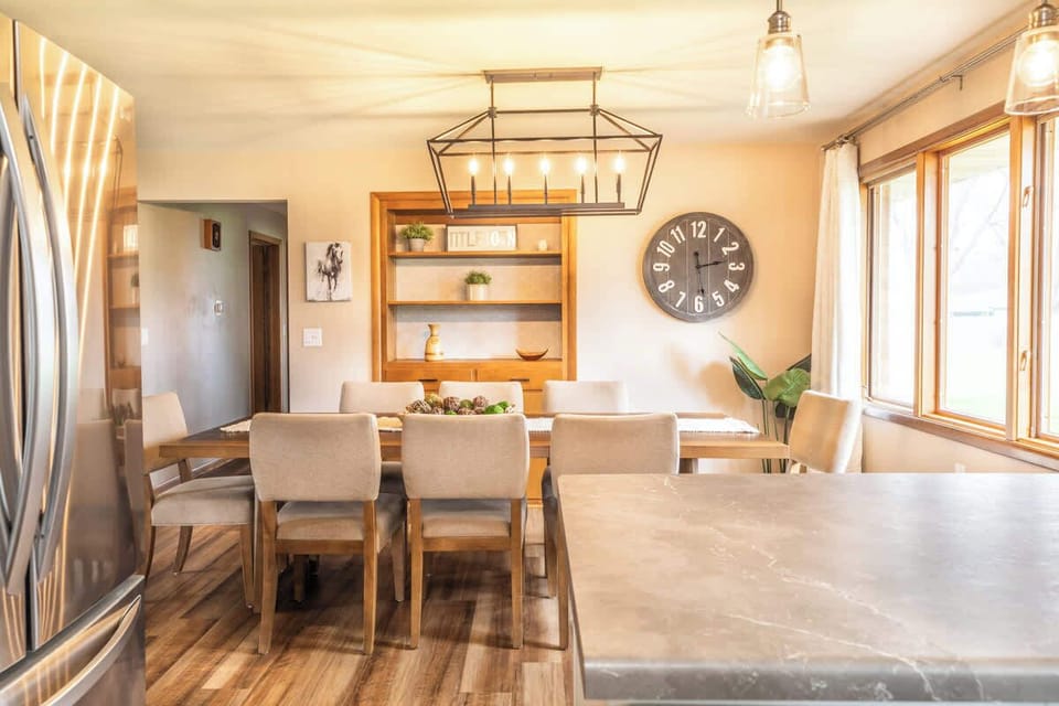 A cozy view from the kitchen into the dining room, showcasing an open and inviting space. The seamless flow between the two areas makes it perfect for entertaining or enjoying meals together, adding to the home's warm, welcoming atmosphere.