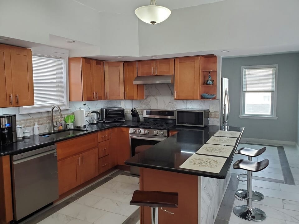 Full Kitchen featuring New Appliances and Island Seating for 3