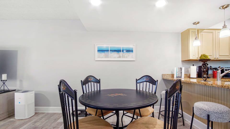 Lower Level: Seating for size guests around the dinning table/two at the counter
